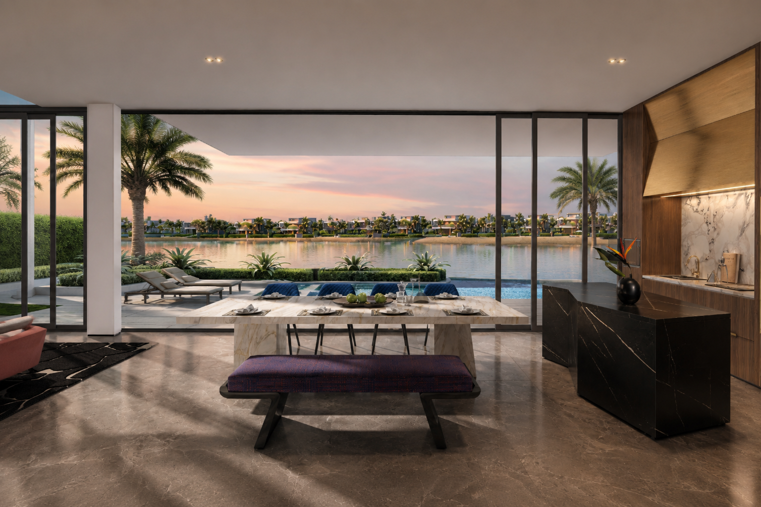 Dining and kitchen interior opening onto the pool and water views